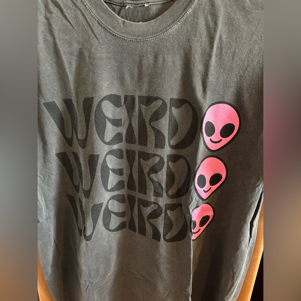 Dressed in Lala brand oversized “Weirdo” t-shirt